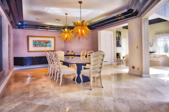 dining space featuring an inviting chandelier