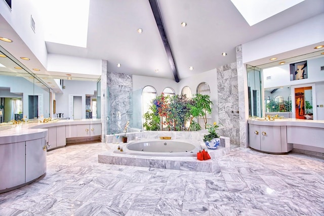 bathroom with vanity, beamed ceiling, independent shower and bath, and high vaulted ceiling