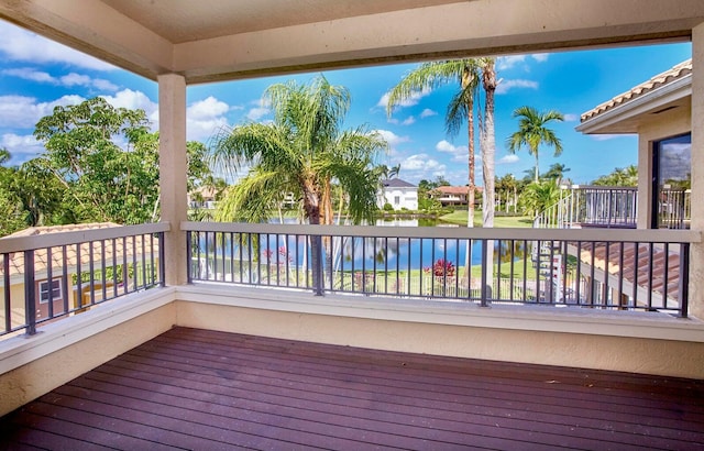 wooden deck featuring a water view