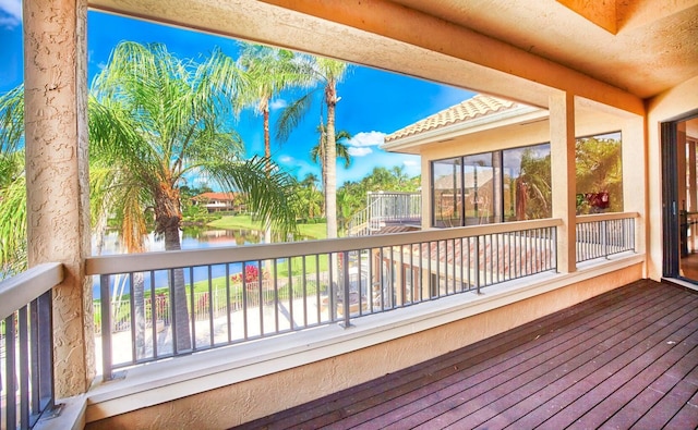 wooden deck with a water view