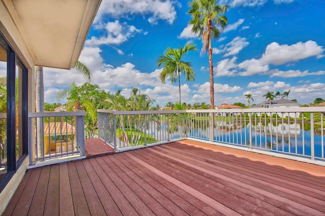 wooden deck with a water view