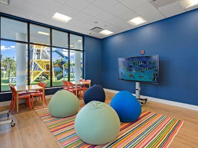 playroom with hardwood / wood-style floors