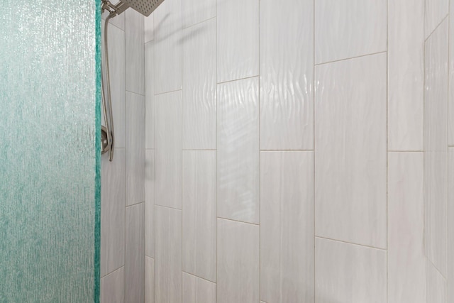 details with a tile shower