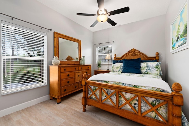 bedroom featuring light hardwood / wood-style floors and ceiling fan