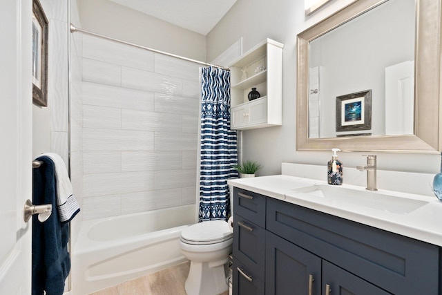 full bathroom featuring vanity, wood-type flooring, shower / tub combo, and toilet