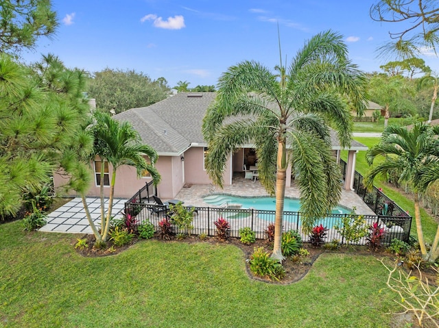 view of swimming pool with a yard and a patio