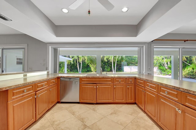 kitchen featuring dishwasher, plenty of natural light, ceiling fan, and sink