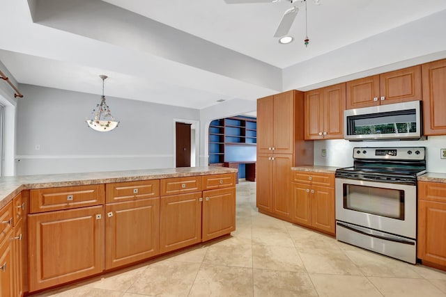 kitchen featuring light tile patterned flooring, stainless steel appliances, hanging light fixtures, and ceiling fan