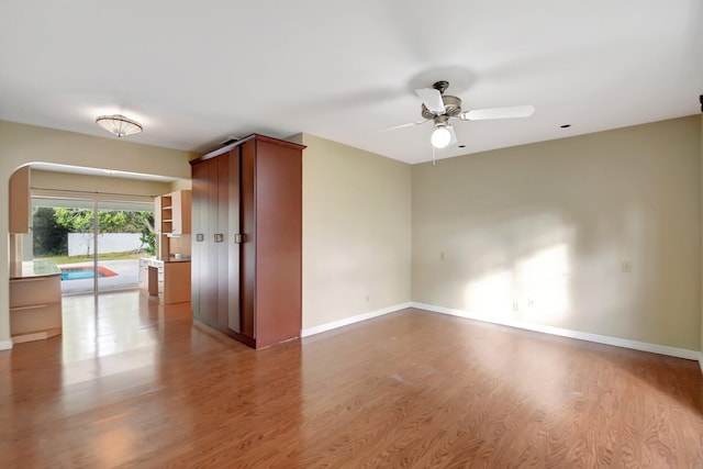 spare room with ceiling fan and hardwood / wood-style flooring