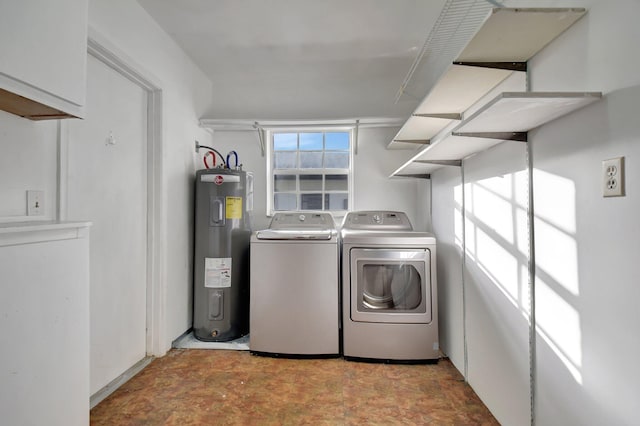 clothes washing area featuring independent washer and dryer and electric water heater