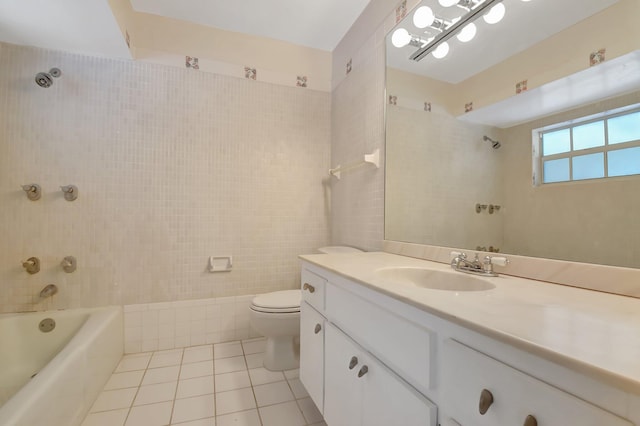 full bathroom with tile patterned flooring, vanity, toilet, and tiled shower / bath combo