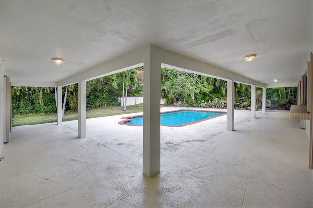 view of swimming pool featuring a patio