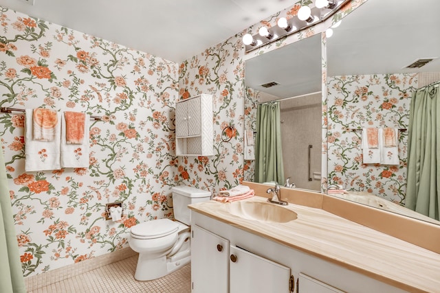 bathroom with tile patterned floors, vanity, and toilet