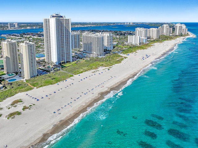 bird's eye view featuring a water view and a view of the beach