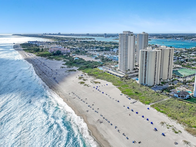 bird's eye view featuring a view of the beach and a water view