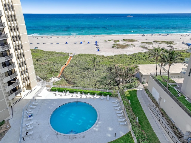 aerial view with a water view and a view of the beach