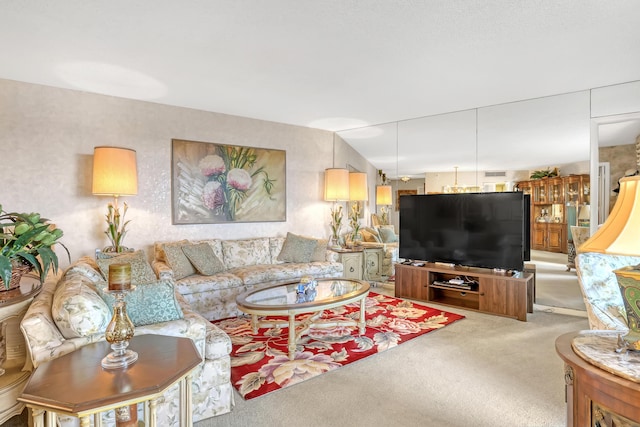 living room featuring carpet and vaulted ceiling