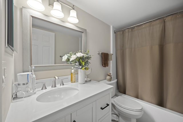 full bathroom with vanity, toilet, and shower / tub combo with curtain