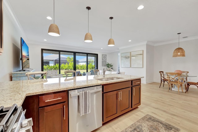 kitchen with dishwasher, sink, hanging light fixtures, light stone countertops, and ornamental molding