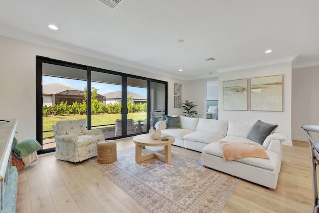 living room with french doors, light hardwood / wood-style floors, and ornamental molding