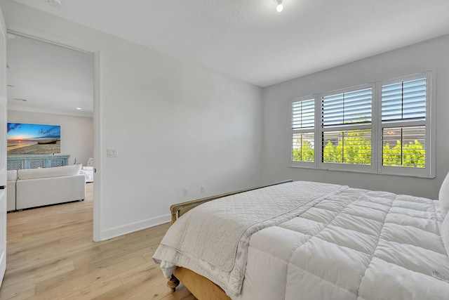 bedroom with light hardwood / wood-style flooring