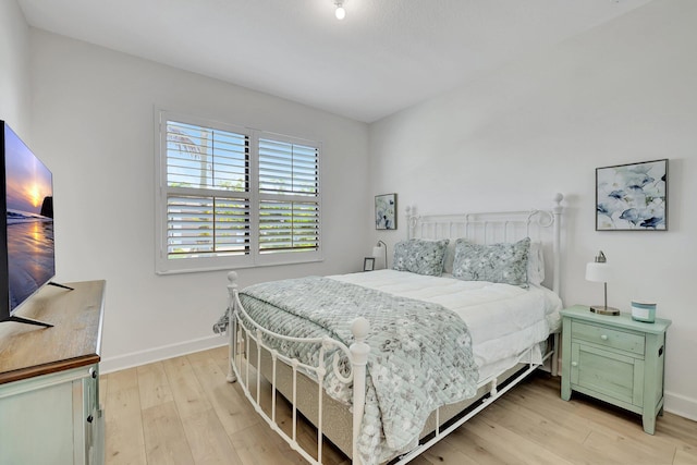 bedroom with light hardwood / wood-style floors