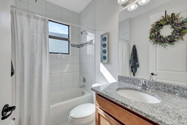 full bathroom featuring shower / bathtub combination with curtain, vanity, and toilet