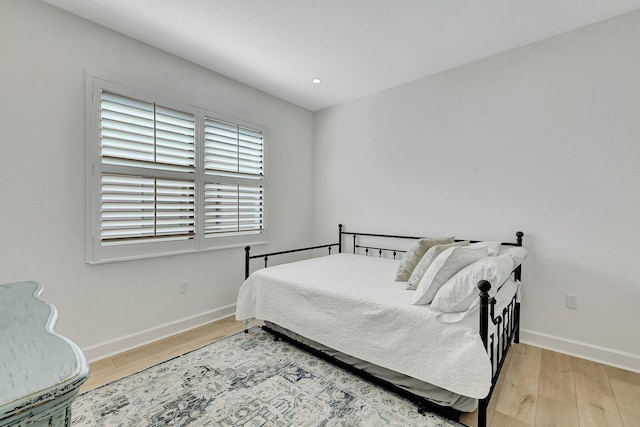 bedroom with wood-type flooring