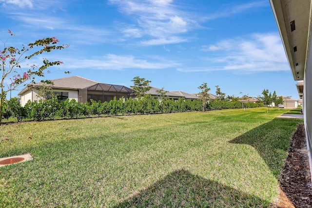 view of yard with a lanai