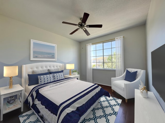 bedroom with a textured ceiling, ceiling fan, and dark wood-type flooring