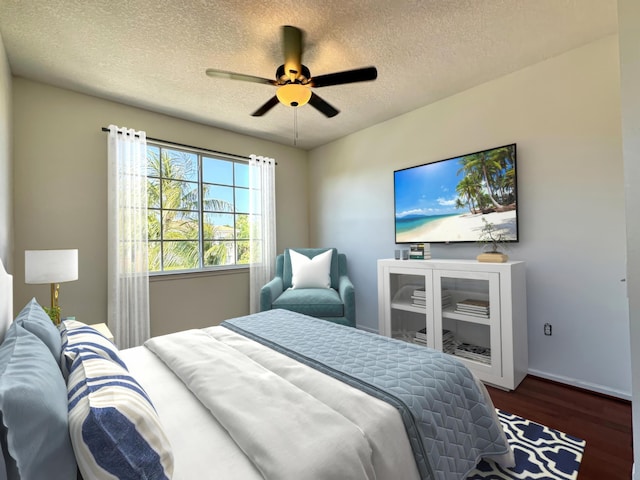 bedroom featuring ceiling fan, dark wood-type flooring, and a textured ceiling