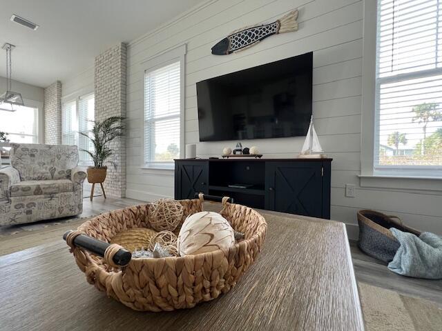 interior space featuring hardwood / wood-style floors and wood walls