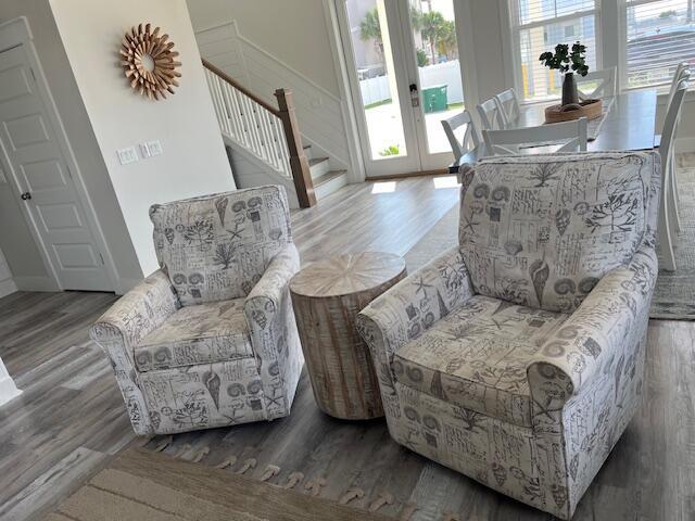 living area featuring hardwood / wood-style floors and french doors