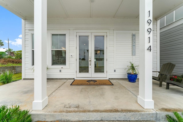 property entrance with covered porch