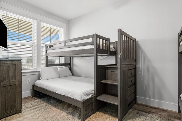 bedroom with hardwood / wood-style flooring