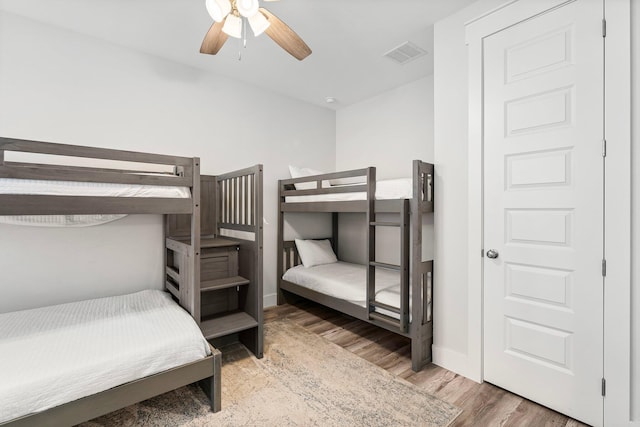 bedroom featuring hardwood / wood-style floors and ceiling fan