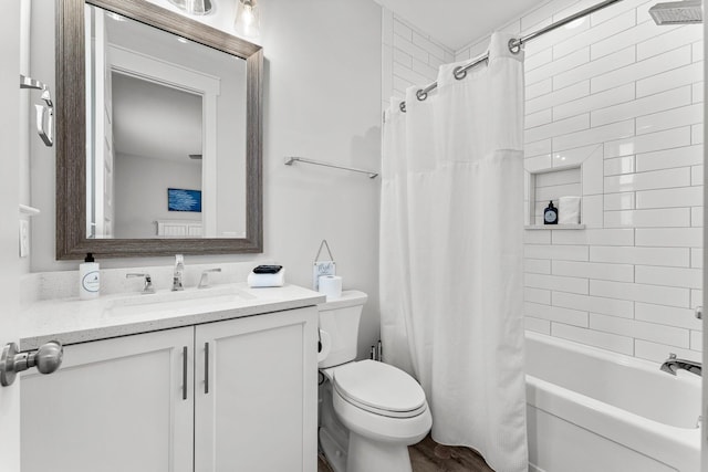 full bathroom with toilet, hardwood / wood-style floors, vanity, and shower / tub combo with curtain