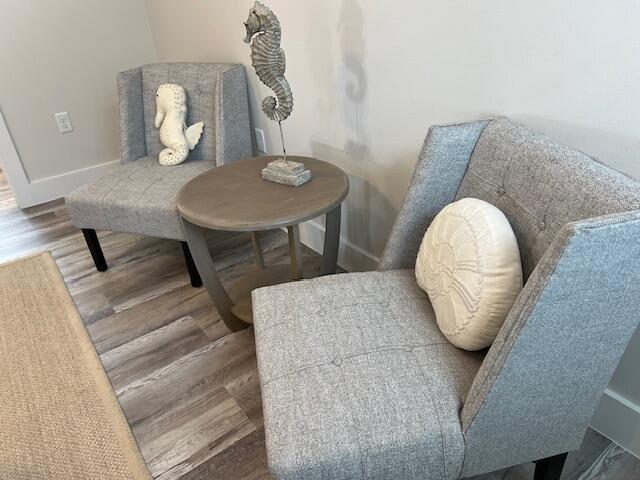 living area with wood-type flooring