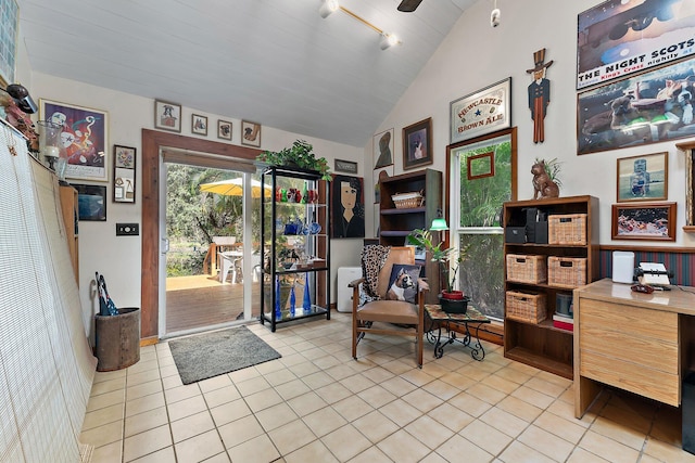 interior space featuring wooden ceiling, track lighting, lofted ceiling, and light tile patterned flooring