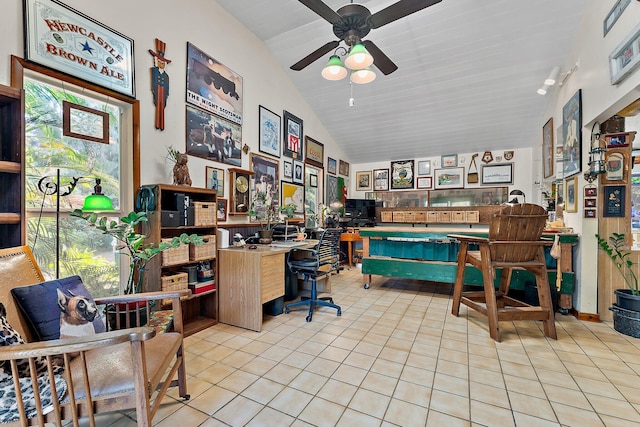 tiled office space with a wealth of natural light, ceiling fan, and vaulted ceiling