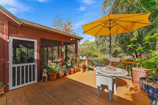 wooden terrace with a sunroom