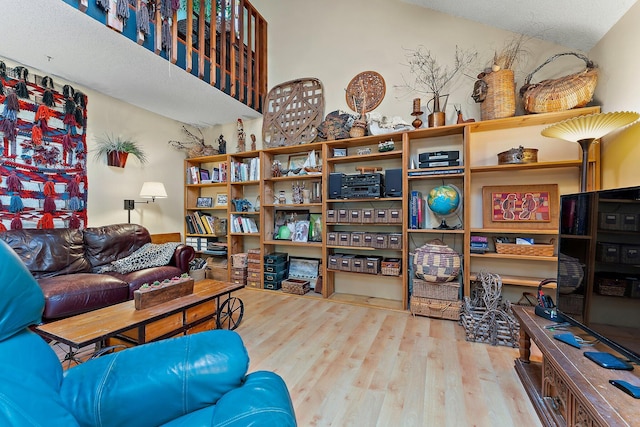 interior space with wood-type flooring and a textured ceiling