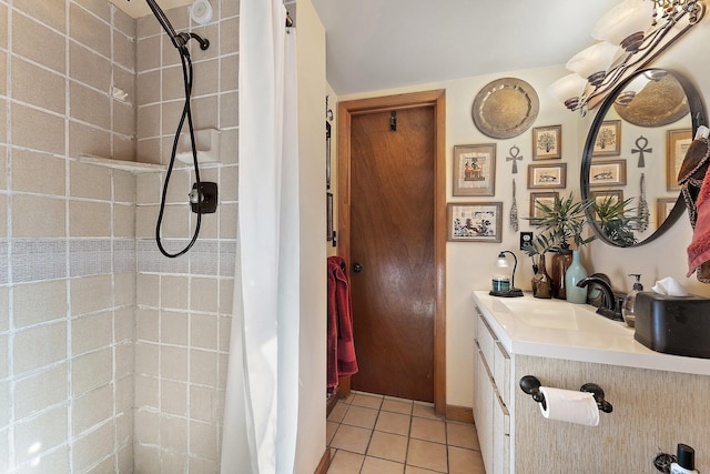 bathroom featuring tile patterned flooring and vanity