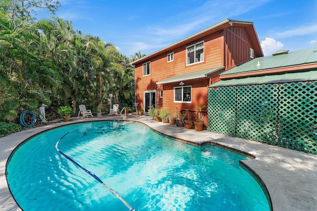 view of pool featuring a patio area