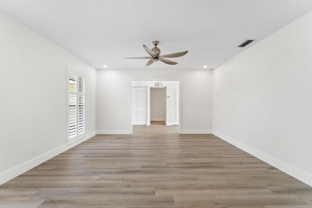 unfurnished room with ceiling fan and light hardwood / wood-style flooring