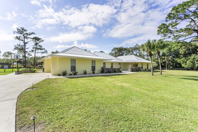 ranch-style home with a front lawn