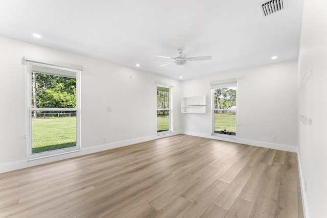 unfurnished room featuring ceiling fan and light wood-type flooring