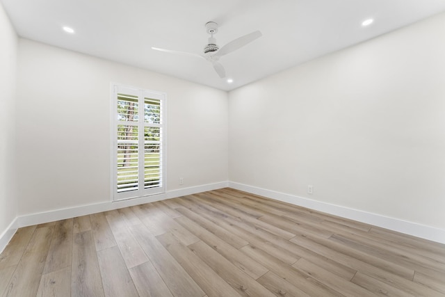 spare room featuring ceiling fan and light hardwood / wood-style flooring