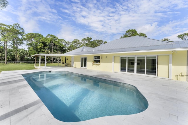 view of pool featuring a patio