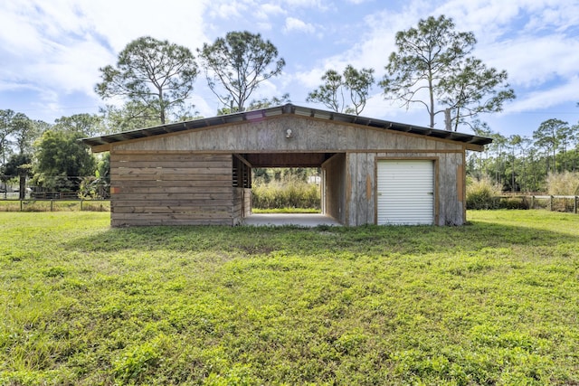 view of outbuilding featuring a yard